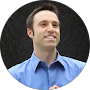 Man smiling in blue shirt